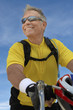 Foto: Man on bicycle ride, portrait, low angle view Man on bicycle ride, portrait, low angle view