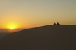 Foto: Quad bikes in desert at sunset, silhouette Quad bikes in desert at sunset, silhouette