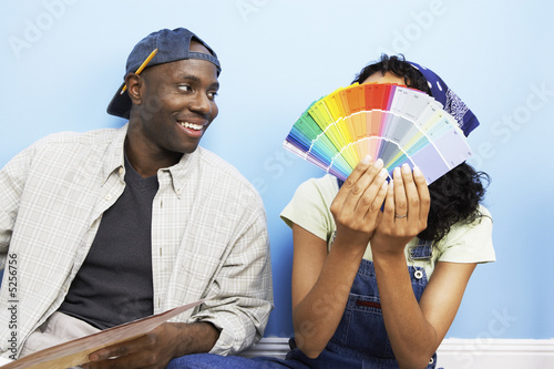 Photo: Couple looking at paint samples Couple looking at paint samples
