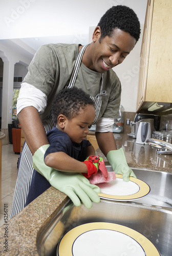 Photo: Son 3-6 helping father wash dishes Son 3-6 helping father wash dishes