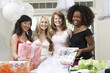 Photo: Friends standing Together with gifts at Bridal Shower Friends standing Together with gifts at Bridal Shower