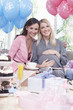 Women sitting on sofa at  baby shower