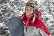 Photo: Young Woman with Snowboard in snow, half length Young Woman with Snowboard in snow, half length