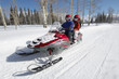 Photo: Couple on Snowmobile Couple on Snowmobile