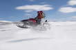 Couple Mid-air on Snowmobile