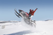 Couple Mid-air on Snowmobile