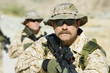 Soldier carrying rifle, outdoors