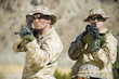Armed soldiers standing side by side, outdoors