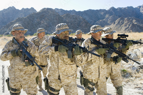Photo: Military soldiers on patrol in mountains Military soldiers on patrol in mountains