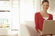 Woman Using Laptop at Home