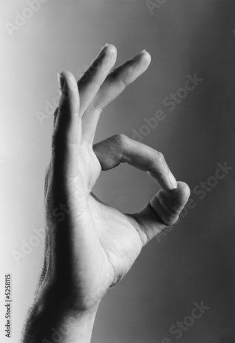 Photo: Hand showing okay gesture, b&w, close-up Hand showing okay gesture, b&w, close-up