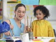 Foto: Elementary Student and Teacher in Art Class Elementary Student and Teacher in Art Class