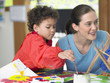 Elementary Student and Teacher in Art Class
