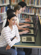 Students Using Laptops in Library
