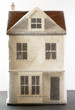 Model of house wrapped in bubble wrap