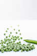 Group of loose peas with empty pea pod, close-up