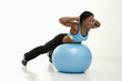 Woman exercising with ball.