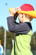 Child swinging baseball bat..