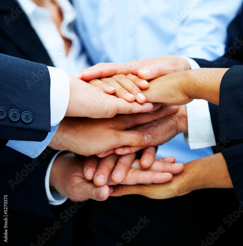 Photo: Multi-ethnic pile of hands Multi-ethnic pile of hands