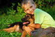 Boy hugging his dog