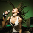 Female singing into mic.