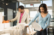 Photo: Couple shopping in store. Couple shopping in store.