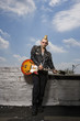 Photo: Punk holding guitar. Punk holding guitar.