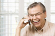 Mature man on cellphone.