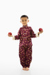 Boy holding apples.
