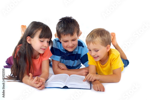 Photo: Kids reading book together Kids reading book together