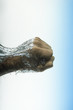 Male Fist Hits Water