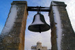 Big bell and church under snow