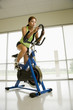Woman exercising on bike.