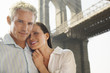 Couple under Brooklyn Bridge