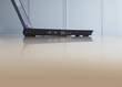 Laptop on desk, side view