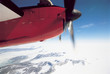 Plane Flying over Snowy Landscape, cropped
