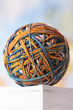 Rubber Band Ball resting on book