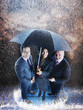 Businesspeople under one umbrella