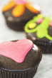 Three cupcakes on kitchen surface
