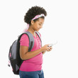 Foto: Schoolgirl with phone. Schoolgirl with phone.