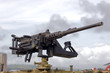 A large machine gun mounted on a military vehicle
