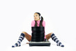 a beautiful young woman sits behind a pile of records a beautiful young woman sits behind a pile of records