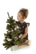 The little girl with a Christmas tree The little girl with a Christmas tree
