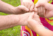 Images : family concept (focus point on hands of the woman)