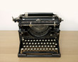 Retro typewriter on a desk - space for text above