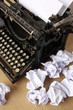 Typewriter with paper scattered - conceptual image