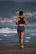 woman jogging on the beach