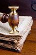 Old judge's gavel on an antique book of over 300 years old