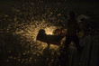 worker cutting steel on the factory