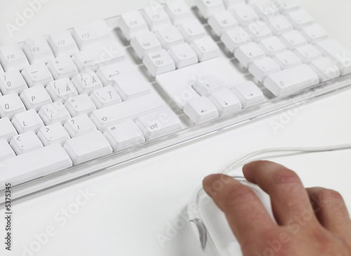 Photo: Man working on computer keyboard Man working on computer keyboard